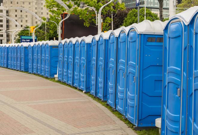 a row of portable restrooms set up for a special event, providing guests with a comfortable and sanitary option in Eagan